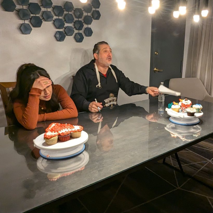 A judge critiquing a contestant at the table